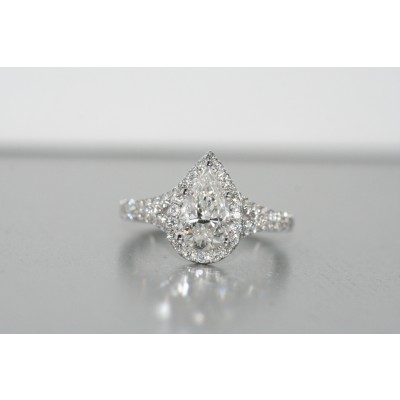 Platinum halo diamond ring with pear shape.