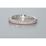 Platinum diamond eternity band with pink and white diamonds.